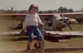 Local resident Deborah Lewis in 1959 sitting on the fence at the Somerset Hills Airport in Basking Ridge, New Jersey