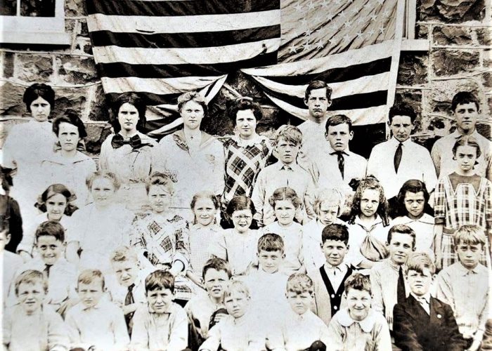 Liberty Corner School students out front taking their class photo. c1915