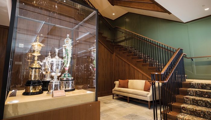 A cabinet featuring the trophies of the U.S. Open, U.S. Women’s Open, U.S. Amateur, and U.S. Women’s Amateur is displayed in the main lobby of the administrative building at the United States Golf Association campus in Liberty Corner.