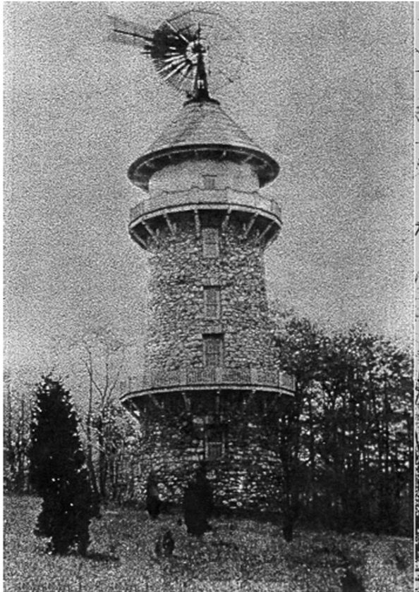 Cross water tower c .1920s with the windmill.